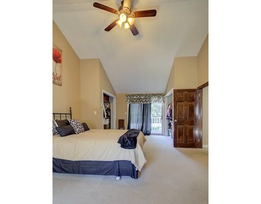 5 Olive Road Billerica, MA 01821 - Photo 20 of 27 a bedroom with a bed and a chandelier