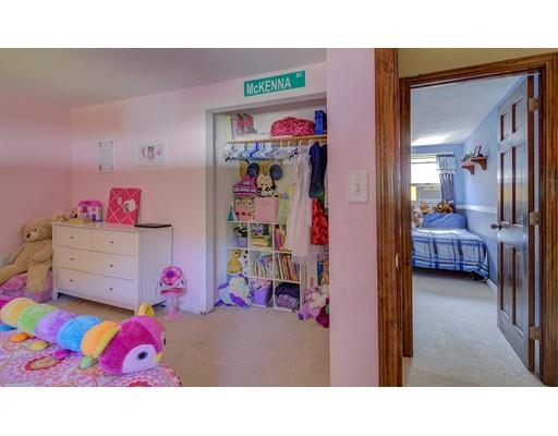 5 Olive Road Billerica, MA 01821 - Photo 21 of 27 a garage filled with furniture and a baby crib