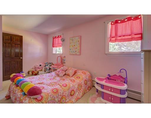 5 Olive Road Billerica, MA 01821 - Photo 23 of 27 a bedroom with a bed and chandelier