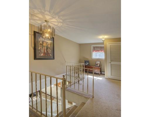 5 Olive Road Billerica, MA 01821 - Photo 26 of 27 a living room with furniture and a chandelier