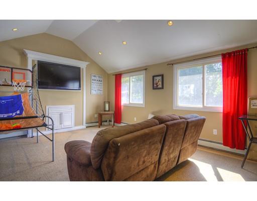 5 Olive Road Billerica, MA 01821 - Photo 10 of 27 a living room with furniture and a flat screen tv