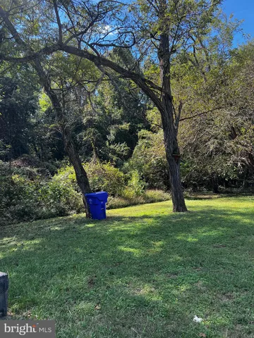 a view of a swimming pool with an outdoor space and seating area
