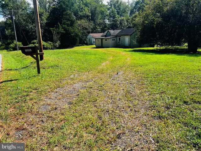 a view of swimming pool with an outdoor seating