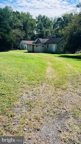 a view of a swimming pool with an outdoor space and seating area