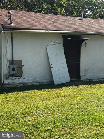 a view of a swimming pool with a yard