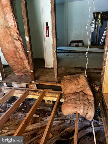 a bed sitting in a room next to a window