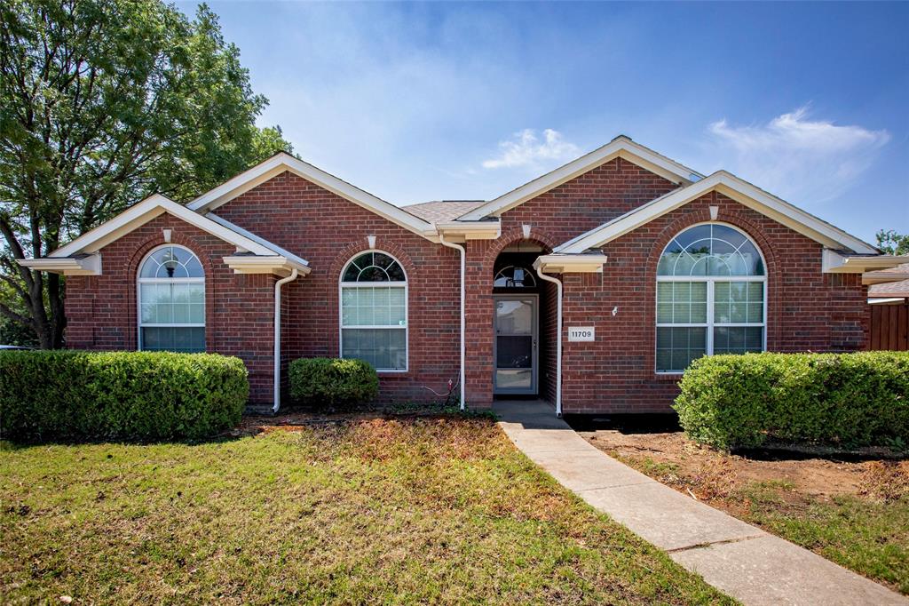 11709 Harbor Road Frisco, TX 75035 - Photo 1 of 12 a front view of a house with a yard