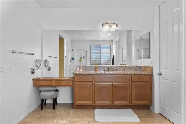 a bathroom with a sink vanity mirror and toilet