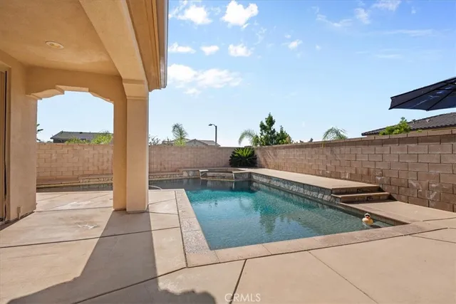 an aerial view of a house with a mountain