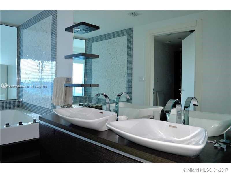 200 South Biscayne Boulevard, Unit 3903 Miami, FL 33131 - Photo 12 of 19 a bathroom with a double vanity sink and a mirror