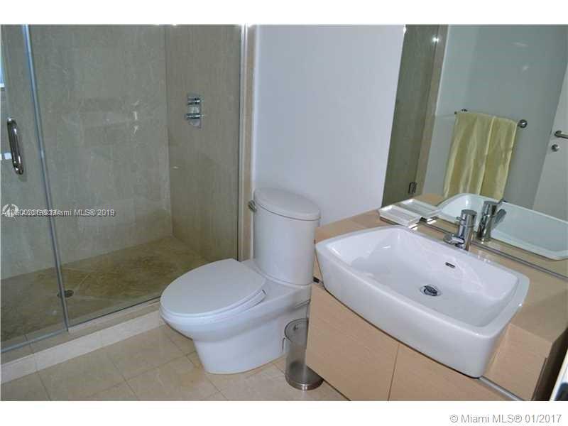 200 South Biscayne Boulevard, Unit 3903 Miami, FL 33131 - Photo 15 of 19 a bathroom with a sink toilet and shower