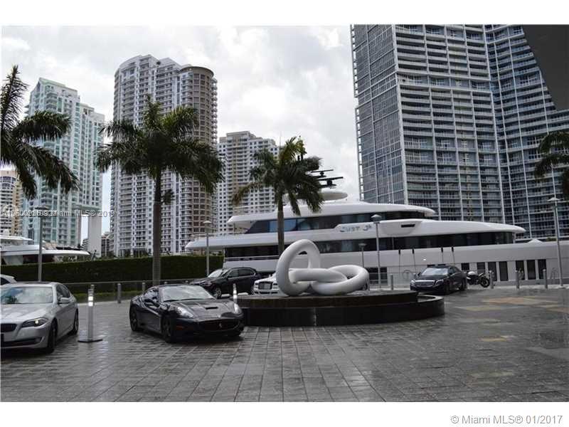 200 South Biscayne Boulevard, Unit 3903 Miami, FL 33131 - Photo 17 of 19 a car parked in front of a buildings