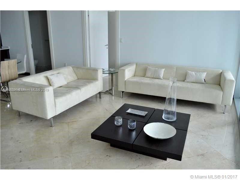 200 South Biscayne Boulevard, Unit 3903 Miami, FL 33131 - Photo 2 of 19 a living room with furniture and a rug