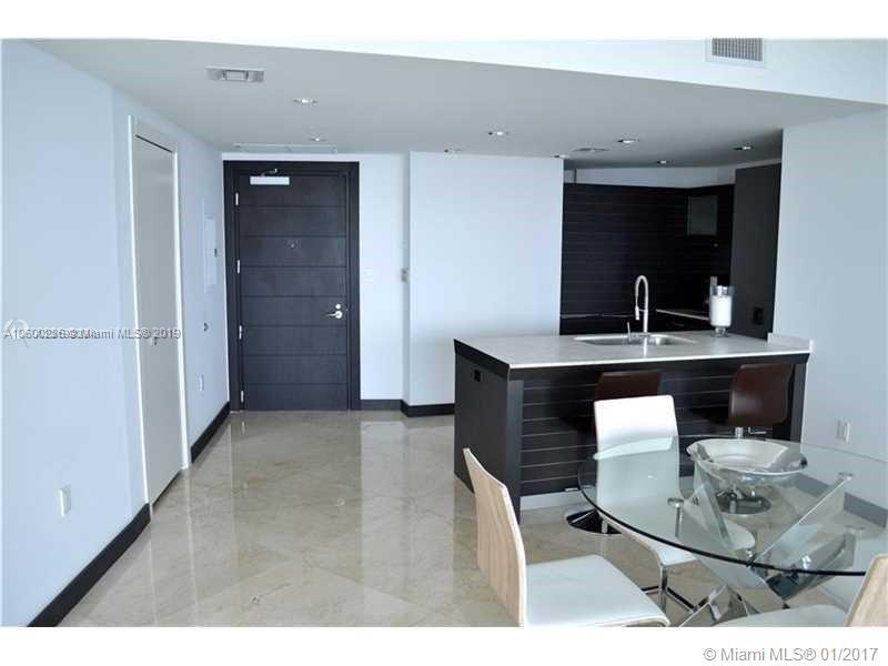 200 South Biscayne Boulevard, Unit 3903 Miami, FL 33131 - Photo 8 of 19 a living room with furniture and a wooden floor