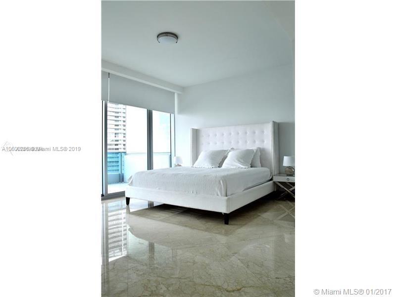 200 South Biscayne Boulevard, Unit 3903 Miami, FL 33131 - Photo 9 of 19 a bedroom with a bed and window