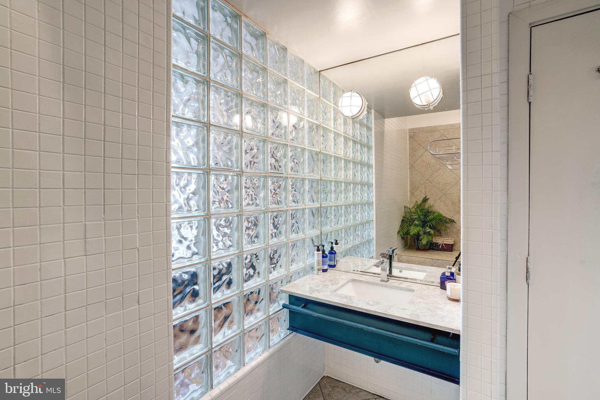 1527 Church Street Northwest, Unit A Washington, DC 20005 - Photo 19 of 31 Modern bathroom with vaulted ceilings