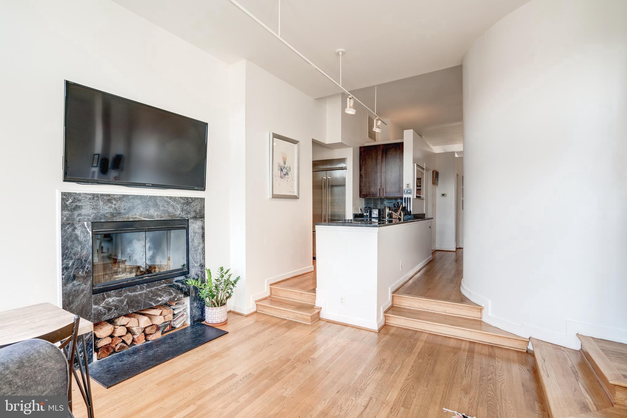 1527 Church Street Northwest, Unit A Washington, DC 20005 - Photo 8 of 31 Wood burning fireplace with storage