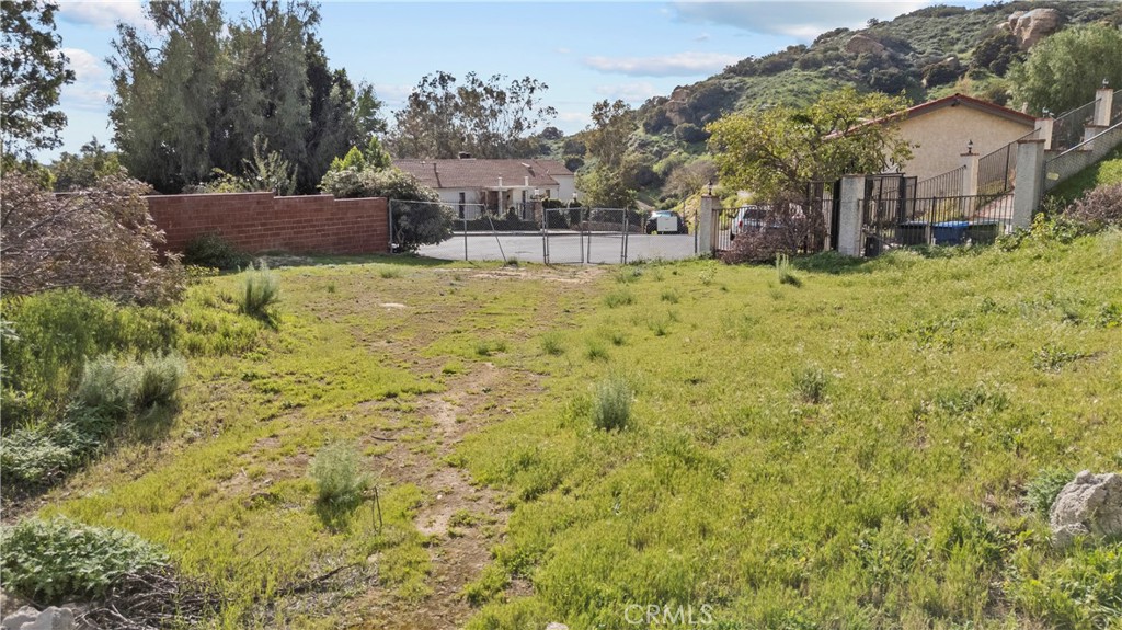 22882 Trigger Street Chatsworth, CA 91311 - Photo 16 of 26 a view of house with yard and trees in the background