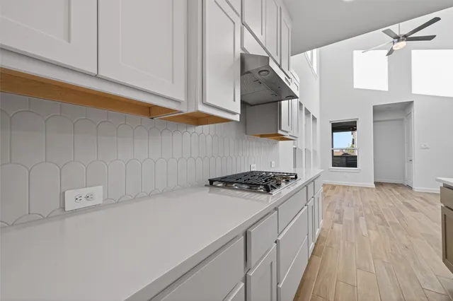 a kitchen with stainless steel appliances a stove and a refrigerator