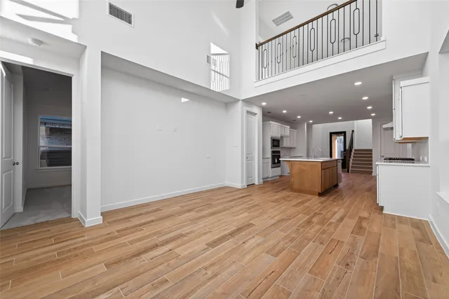 a view of a kitchen with a sink and a refrigerator