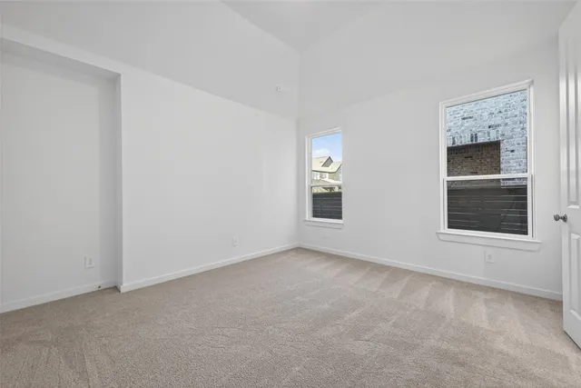 a en suite bathroom with a granite countertop sink and a mirror