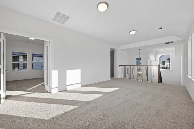 a view of empty room with windows