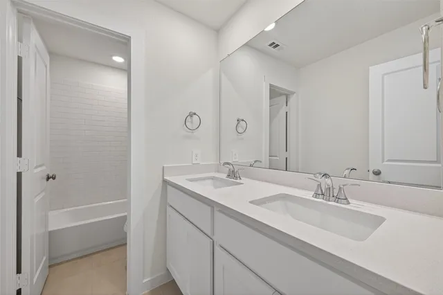 a bathroom with a bathtub and toilet