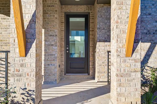 a view of a brick entrance of the building