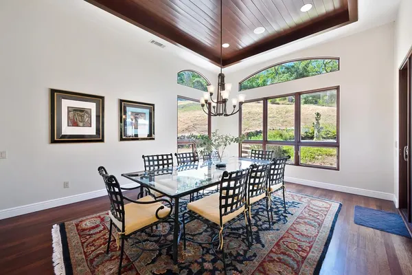 a kitchen with stainless steel appliances granite countertop a sink and a refrigerator