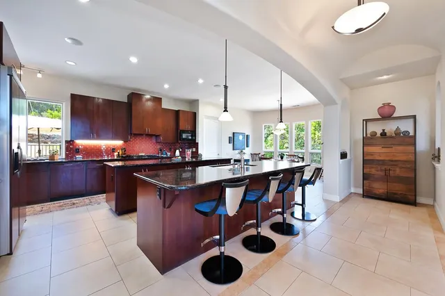 a room with table and flat screen tv
