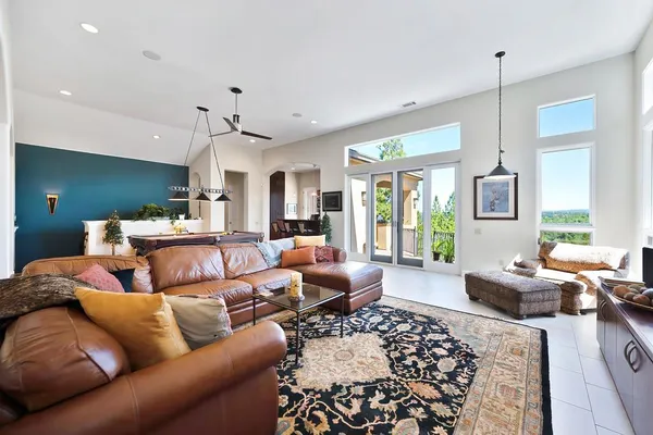 a view of a livingroom with workspace and a window