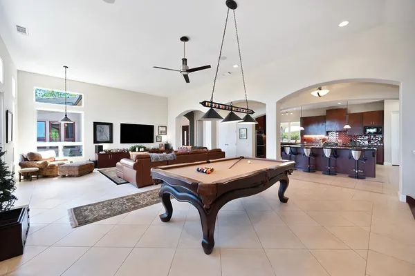 a spacious bedroom with a bed and a fireplace