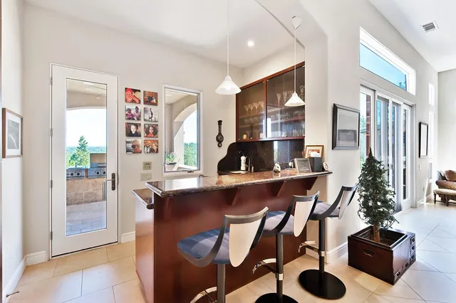 a spacious bathroom with a tub sink and mirror