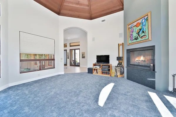 a bathroom with a granite countertop sink a potted plant and a mirror