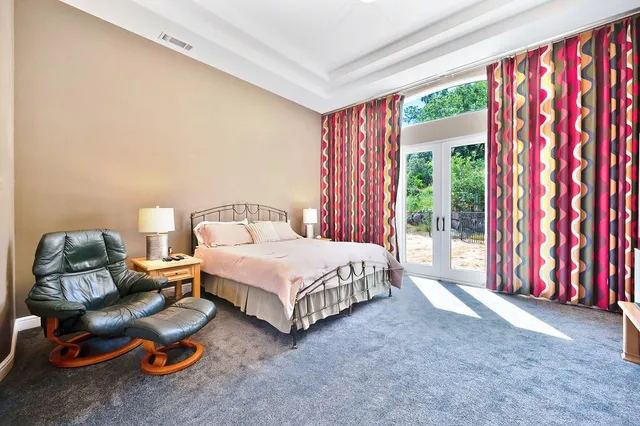 a view of a chair and table on the deck