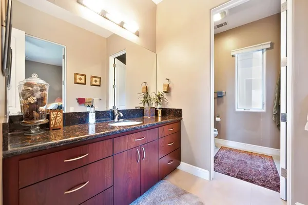 a view of a balcony with wooden floor and city view