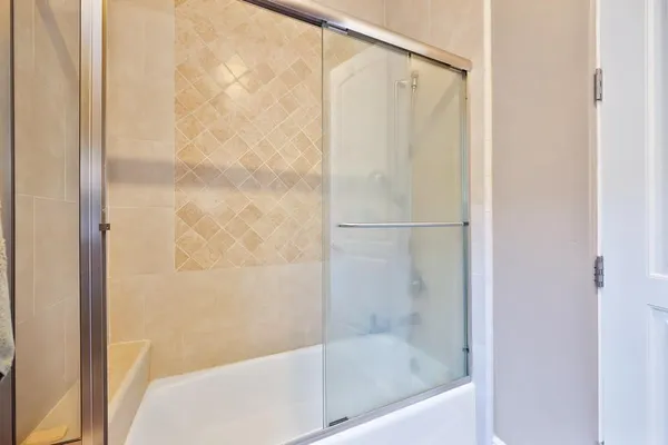 an aerial view of a house with a yard and large trees