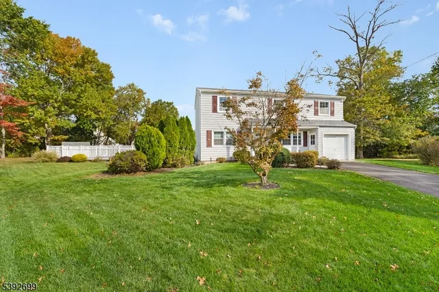 a view of house with yard