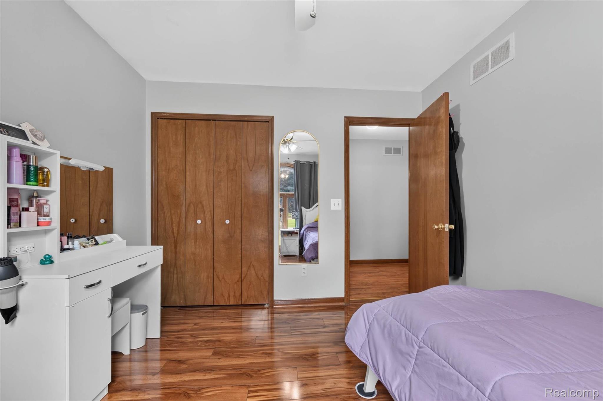 46362 Springhill Drive Utica, MI 48317 - Photo 26 of 59 Warm wood-finish flooring complemented by light gray wall tones