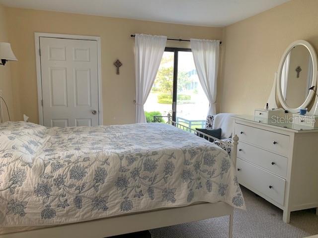 455 Alt 19, Unit 65 Palm Harbor, FL 34683 - Photo 11 of 16 a bedroom with a bed and a window