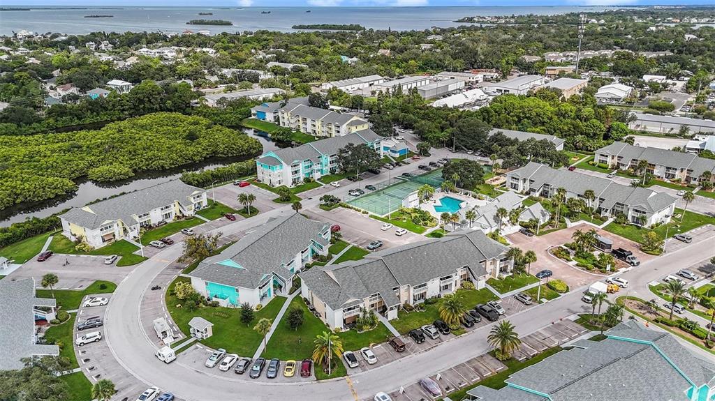 455 Alt 19, Unit 65 Palm Harbor, FL 34683 - Photo 14 of 16 an aerial view of residential houses with outdoor space