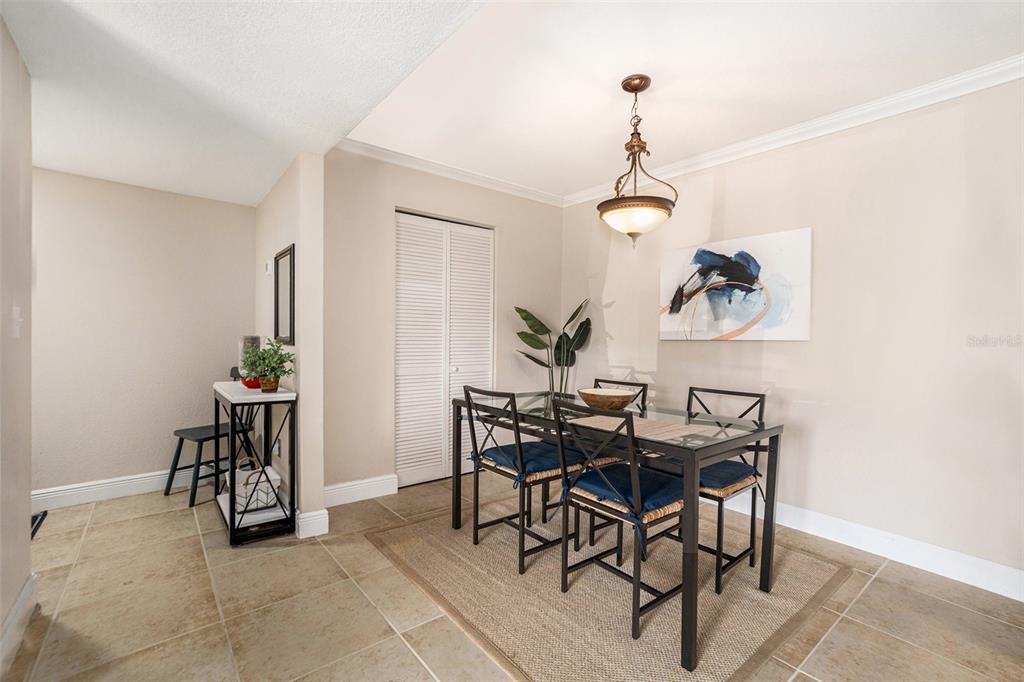 455 Alt 19, Unit 65 Palm Harbor, FL 34683 - Photo 5 of 16 a view of a dining room that has a table and chairs in it