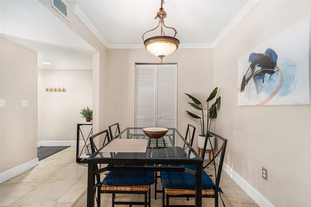 455 Alt 19, Unit 65 Palm Harbor, FL 34683 - Photo 6 of 16 a view of a dining room with furniture and wooden floor