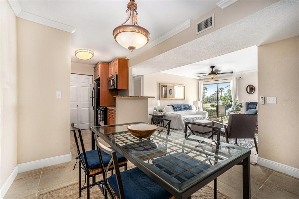 455 Alt 19, Unit 65 Palm Harbor, FL 34683 - Photo 7 of 16 a view of a dining room with furniture