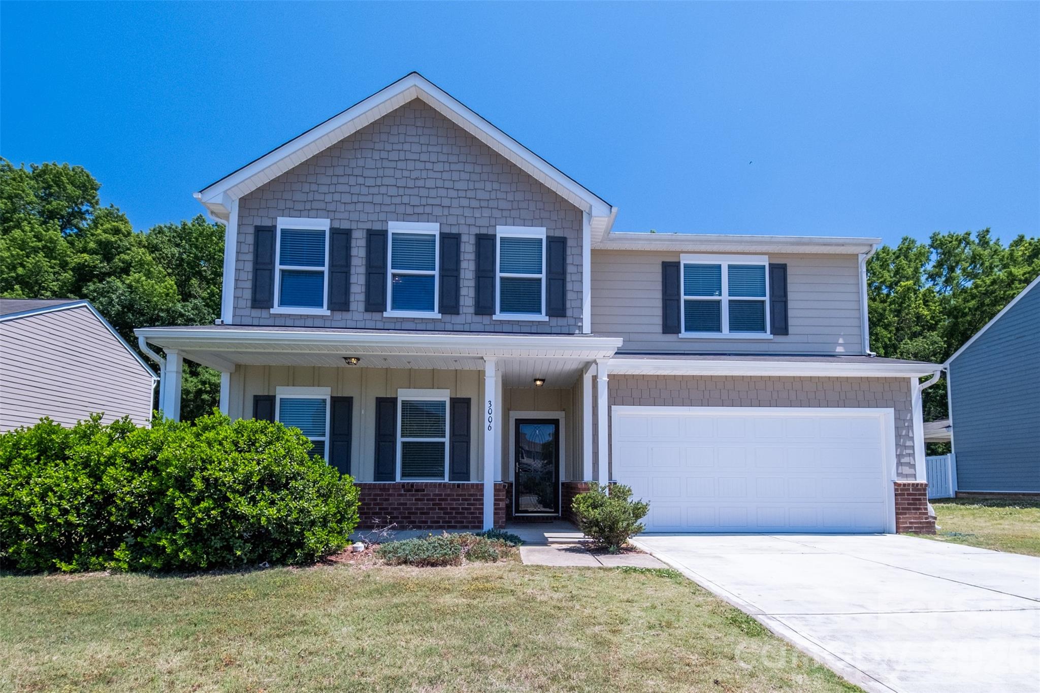 3006 Houndscroft Road Indian Trail, NC 28079 - Photo 1 of 39 a front view of a house with a yard and garage