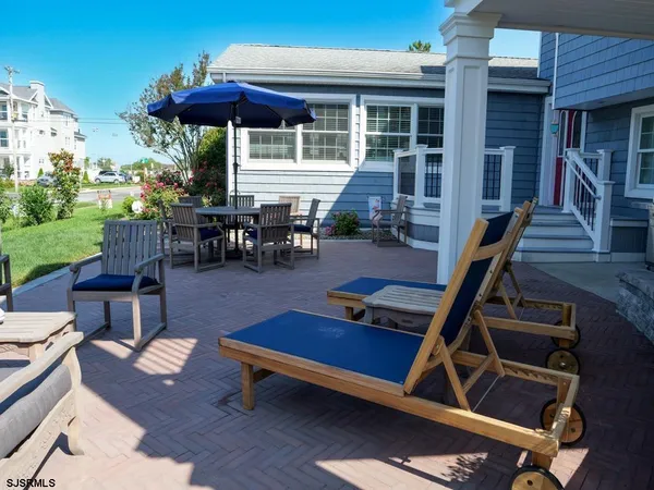 a view of a backyard with furniture