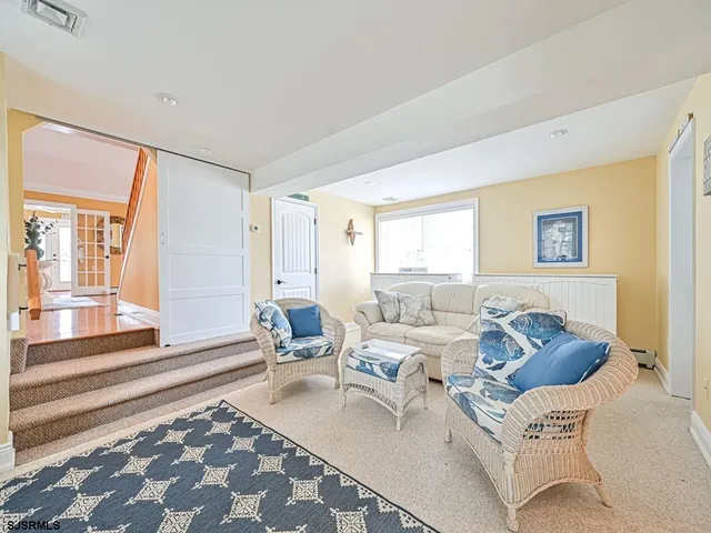 a living room with furniture and a rug