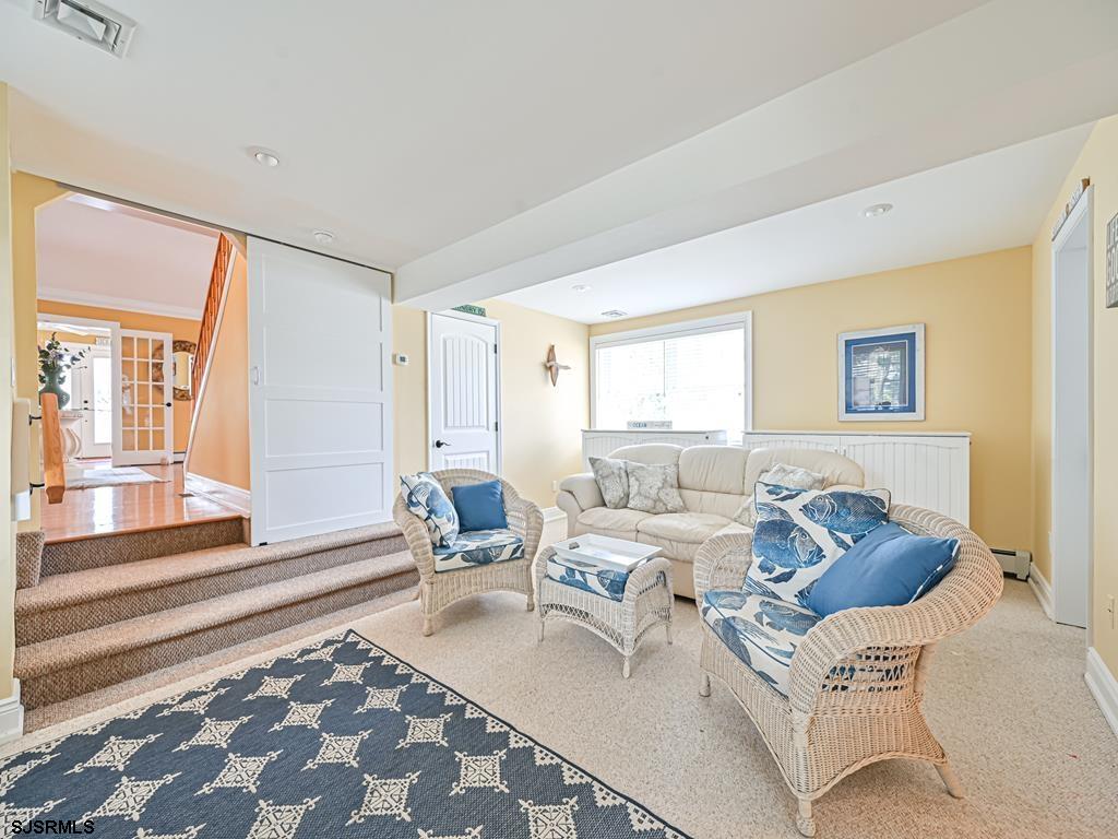 2304 Ocean Avenue Brigantine, NJ 08203 - Photo 21 of 27 a living room with furniture and a rug
