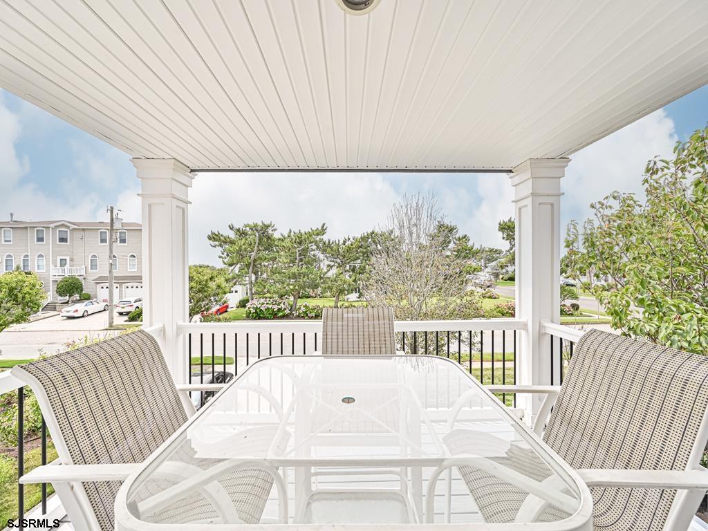 2304 Ocean Avenue Brigantine, NJ 08203 - Photo 21 of 27 a view of a white bed sitting on a roof deck