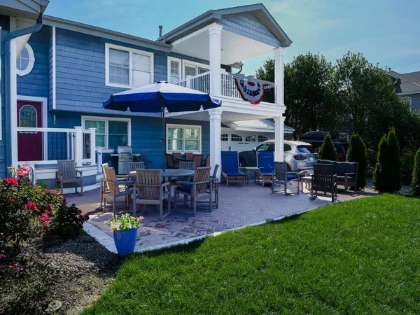 a table and chairs in front of house